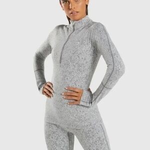 Gymshark grey marl Fluer texture half zip cross open back.